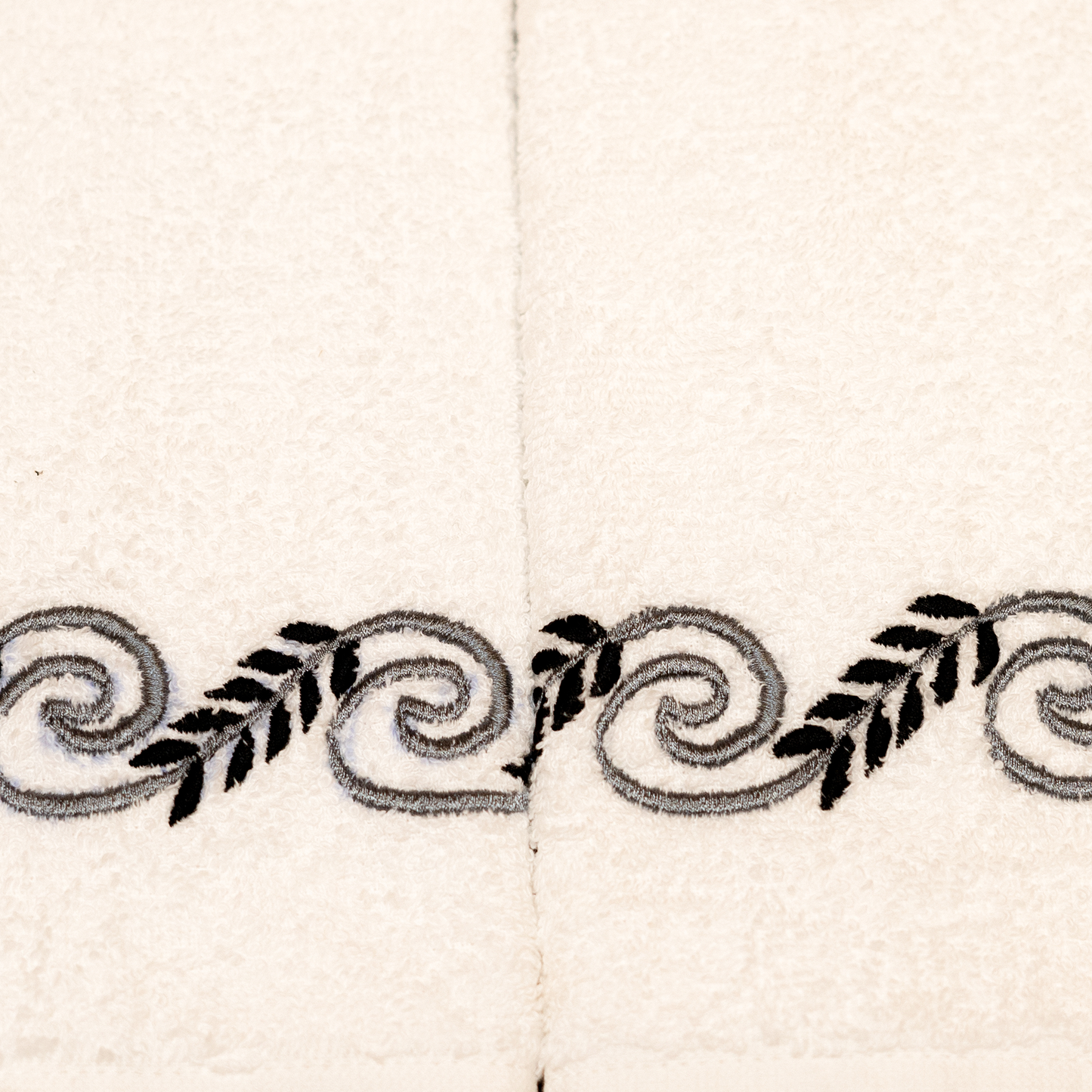 The LuxeLife White Hand Towel with Grey & Black Embroidered