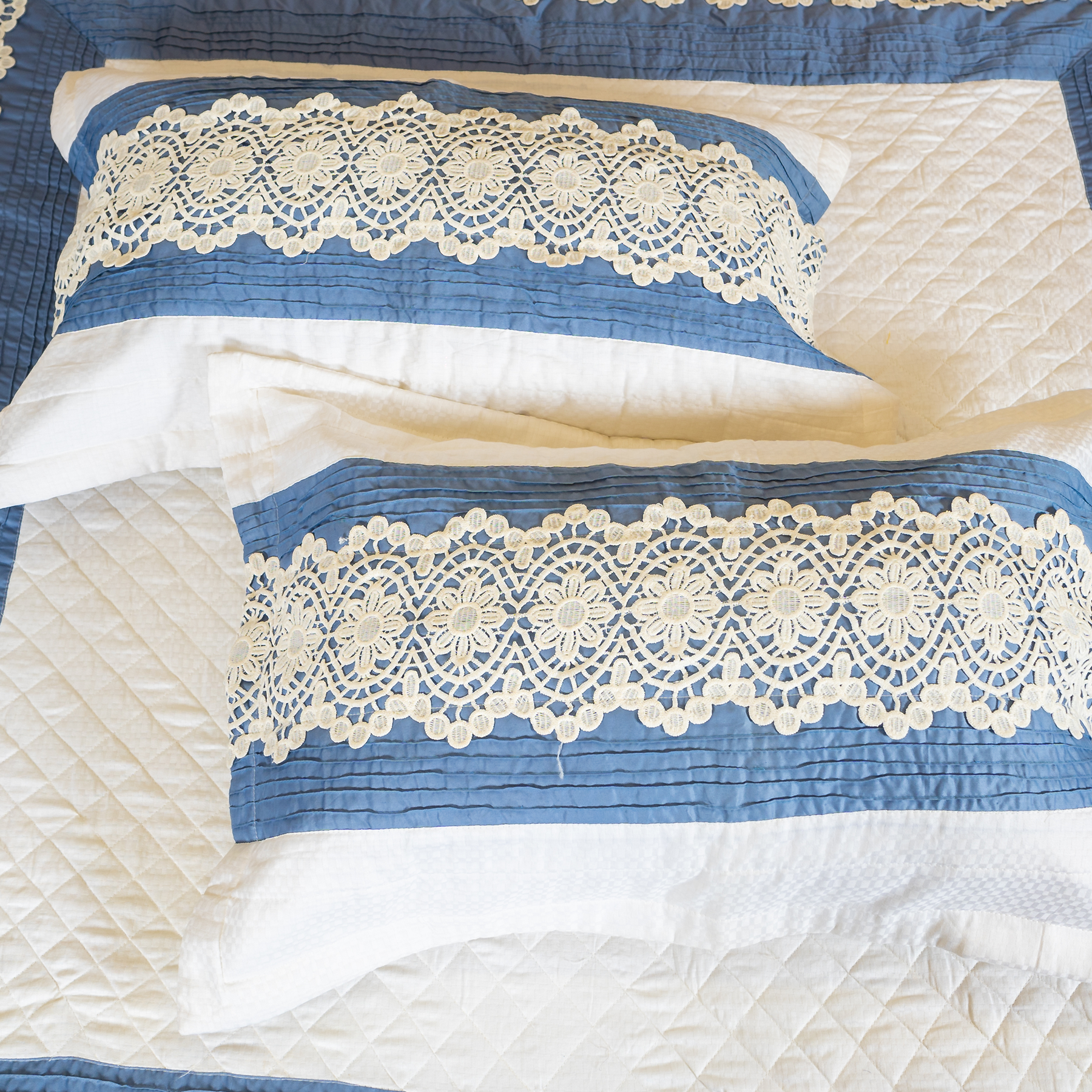 The LuxeLife White Cotton quilted Bedcover with lace