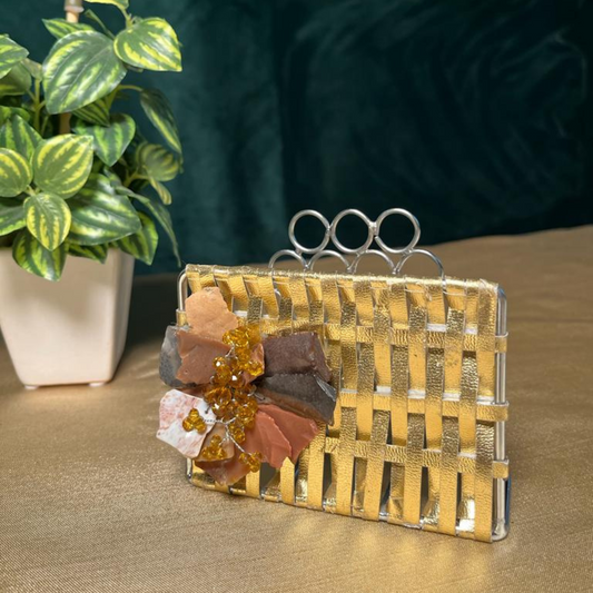 The LuxeLife Golden Tissue Holder with Flower at the front