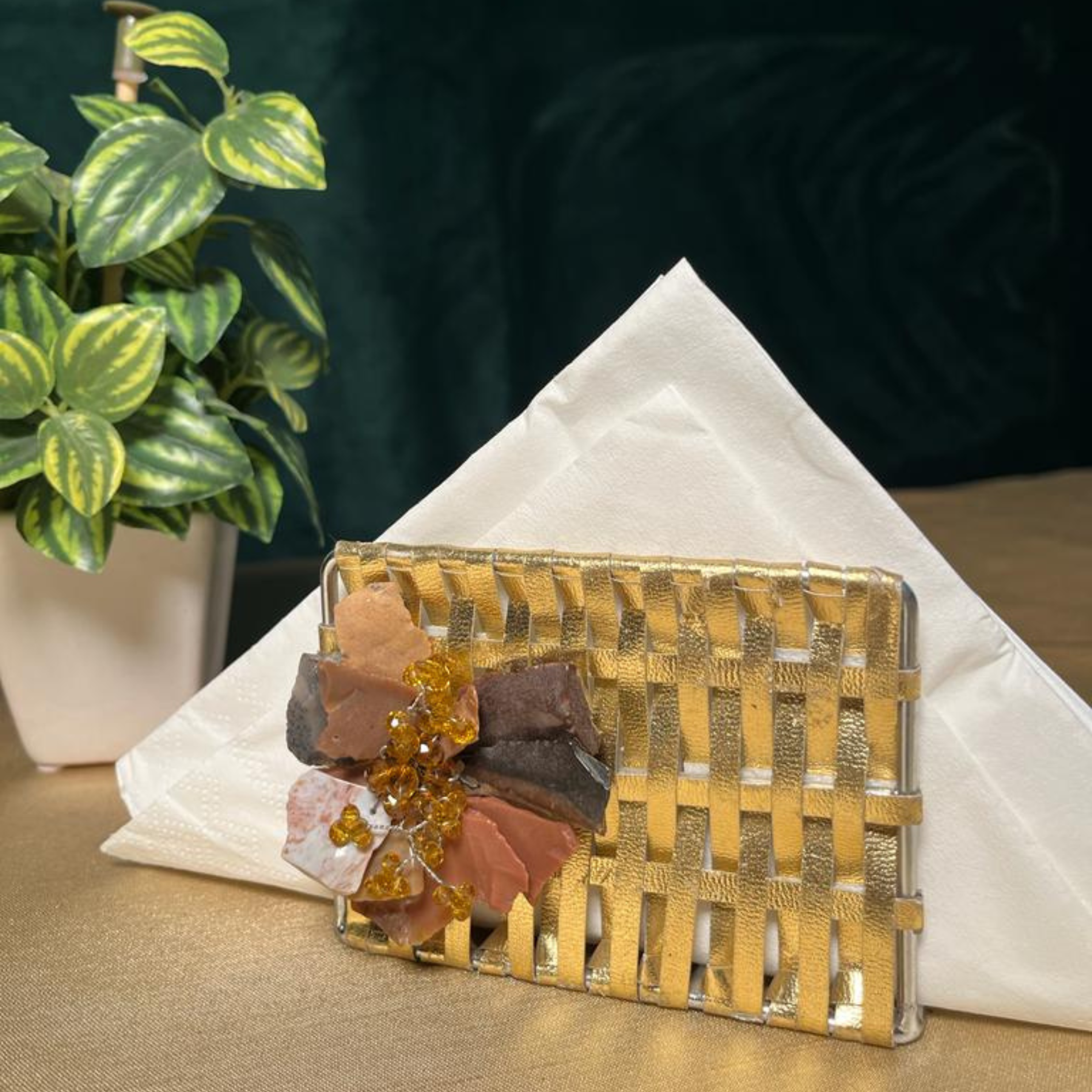 The LuxeLife Golden Tissue Holder with Flower at the front