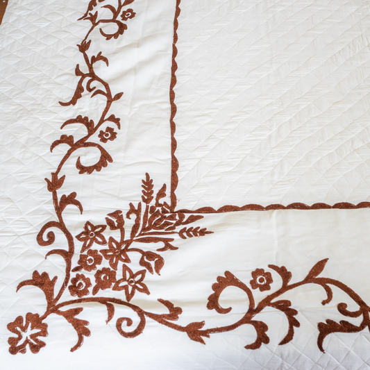 The LuxeLife White Quilted Brown Embroidered Bedcover